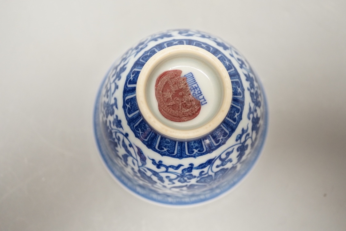 A Chinese blue and white 'lotus' cup. 9cm diameter